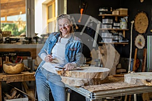 Portrait of confident craftswoman in her workshop