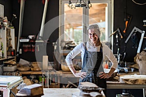 Portrait of confident craftswoman in her workshop