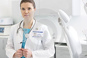 Portrait of confident doctor in labcoat with stethoscope at dental clinic