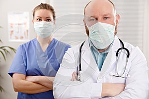 Portrait Of Confident Doctor And Nurse In Hospital