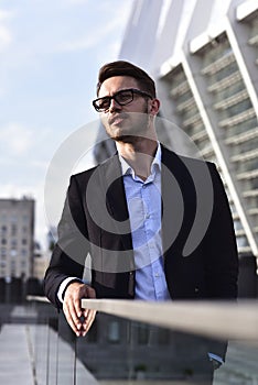 Portrait of confident handsome man, in elegant suit, successful businessman