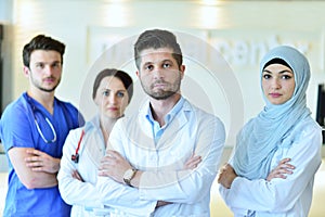 Portrait of confident happy group of doctors standing at the medical office