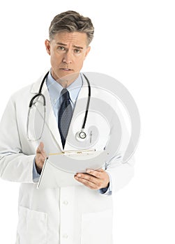 Portrait Of Confident Male Doctor Gesturing At Clipboard