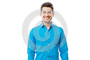 Confident Male Wearing Blue Shirt On Plain Background