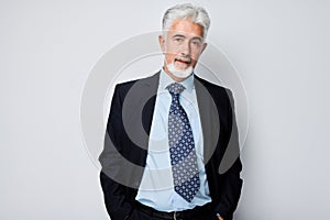 Portrait of confident mature businessman with serious face and gray hair. Good looking 60 year old man