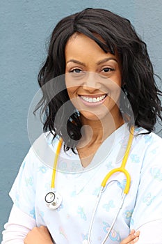 Portrait Of A Confident Mature Female African Doctor Looking At Camera Isolated On Blue Background