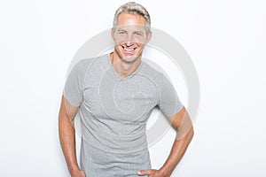 Portrait of confident mature man standing on white background