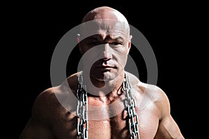 Portrait of confident muscular man with chain