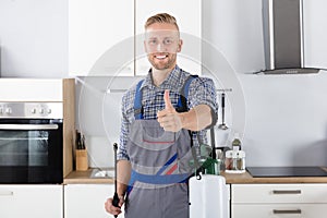 Confident Pest Control Worker With Pesticide Container photo