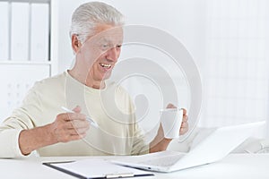 Portrait of confident senior businessman in office