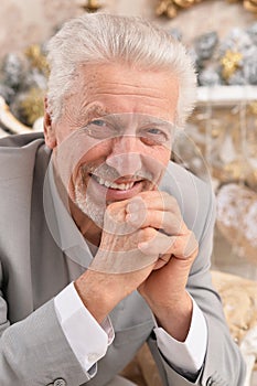 Portrait of confident senior businessman sitting in chair