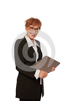 Portrait of confident senior executive manager. Stylish middle age woman in black business suit posing isolated on white