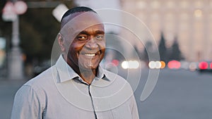 Portrait confident smiling happy adult entrepreneur, afro black man with healthy white-toothed smile, mature african