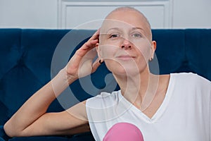 Portrait of confident strong woman with no hair, cancer survivor photo