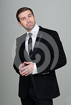 Portrait of a confident and successful businessman in black suit