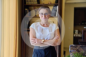 Portrait of confident successful middle aged woman looking at camera.