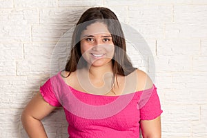 Portrait confident teen girl on white background