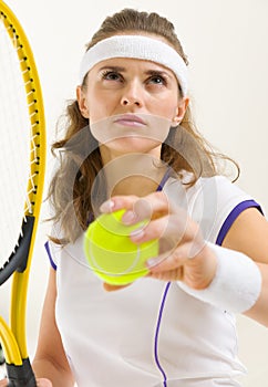 Portrait of confident tennis player ready to serve