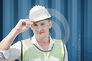 Portrait Confident Transport Engineer Man in Safety Equipment Standing in Container Ship Yard. Transportation Engineering