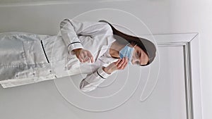 Portrait of confident woman healthcare worker wearing medical face mask for disease protection. Professional female nurse