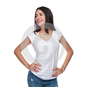 Portrait of confident woman in white t-shirt looking to side