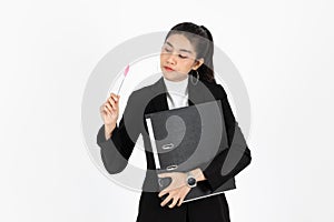 Portrait of confident young Asian business woman in suit holding pen and having an idea on white isolated background