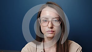 Portrait confident young attractive businesswoman looking at camera serious successful beautiful at home office close up