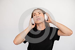 Portrait of confident young woman listening to music