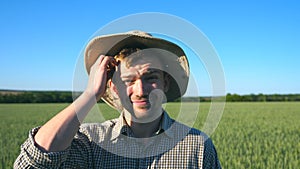 Portrait of confused male farmer looking into the camera and scratching his head. Close up of young doubtful man