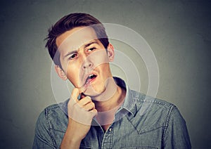 Portrait of a confused perplexed man