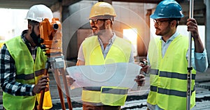 Portrait of construction engineers working on building site