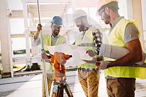 Portrait of construction engineers working on building site