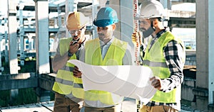 Portrait of construction engineers working on building site