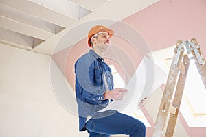 Thinking construction worker portrait