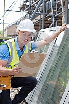 Portrait Of Construction Worker Preparing To Fit New Windows