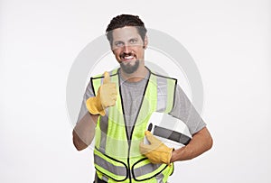 Portrait of a construction worker showing thumbs up