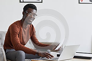 African Businessman Working in Designer Interior