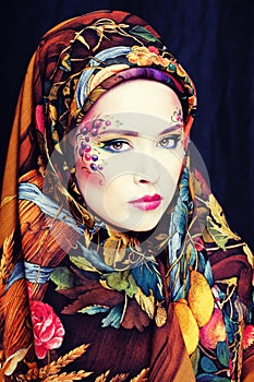Portrait of contemporary noblewoman with face art photo