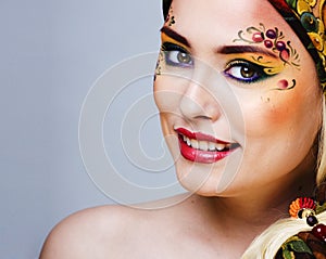 portrait of contemporary noblewoman with face art creative, young retty lady with color berryes on face