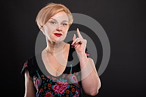 Portrait of cool fashionable woman posing having idea