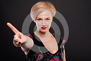 Portrait of cool fashionable woman showing denial gesture