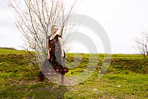 Portrait of cool fashionable woman wearing dress and shades