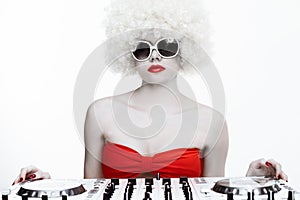 Portrait of a cool female DJ, on white