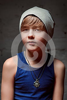 Portrait of cool young hip hop boy in grey hat