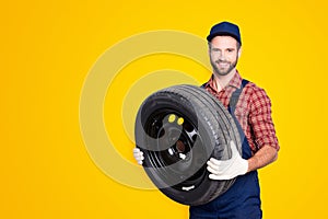 Portrait with copy space, empty place for advertisement of joyful cheerful mechanic in blue overall, shirt having