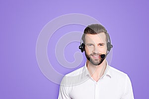 Portrait with copy space, empty place for advertisement of stylish, cheerful, harsh, virile operator having headset with