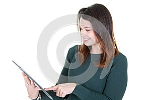 Portrait with copy space empty place of pretty confident trendy woman having tablet in hands isolated on white background