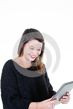 Portrait with copy space empty place of pretty young woman having tablet in hands on white background