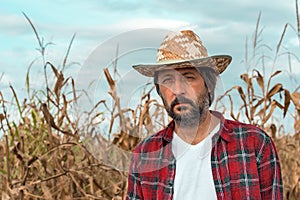 Portrait of corn farmer in ripe maize crop field