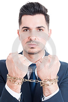 Portrait of corrupt businessman or lawyer with chained hands